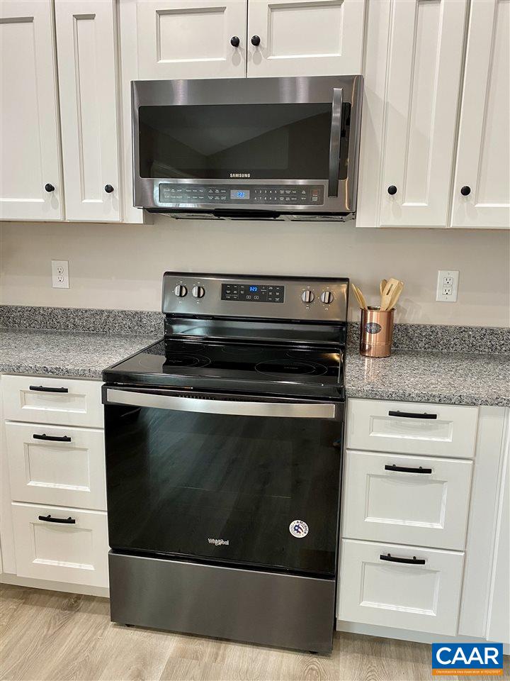 907 New Hope Road Staunton, VA 24401 - Photo 17 of 50 a kitchen with microwave stove and cabinets