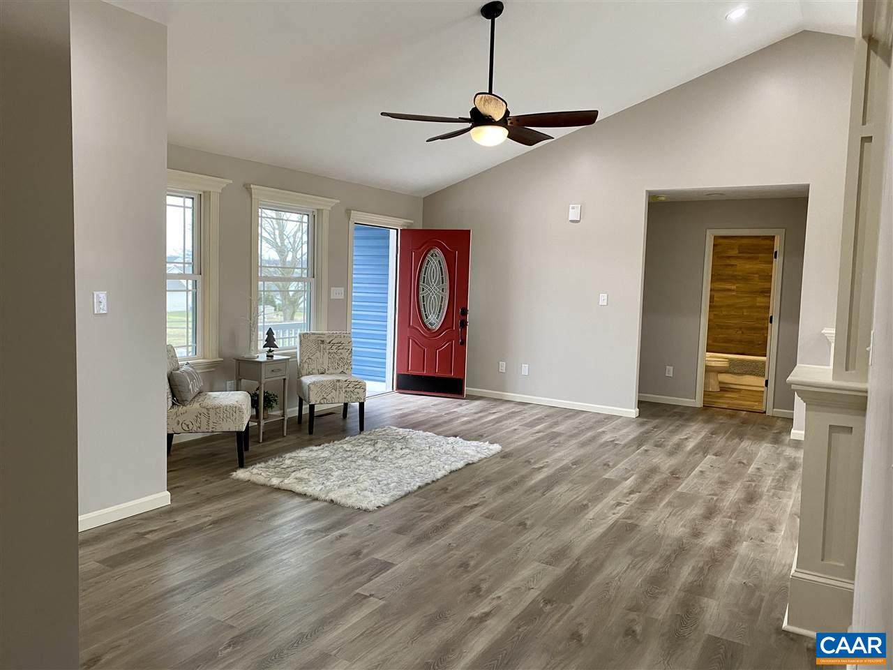 907 New Hope Road Staunton, VA 24401 - Photo 3 of 50 a bedroom with a bed and a chandelier