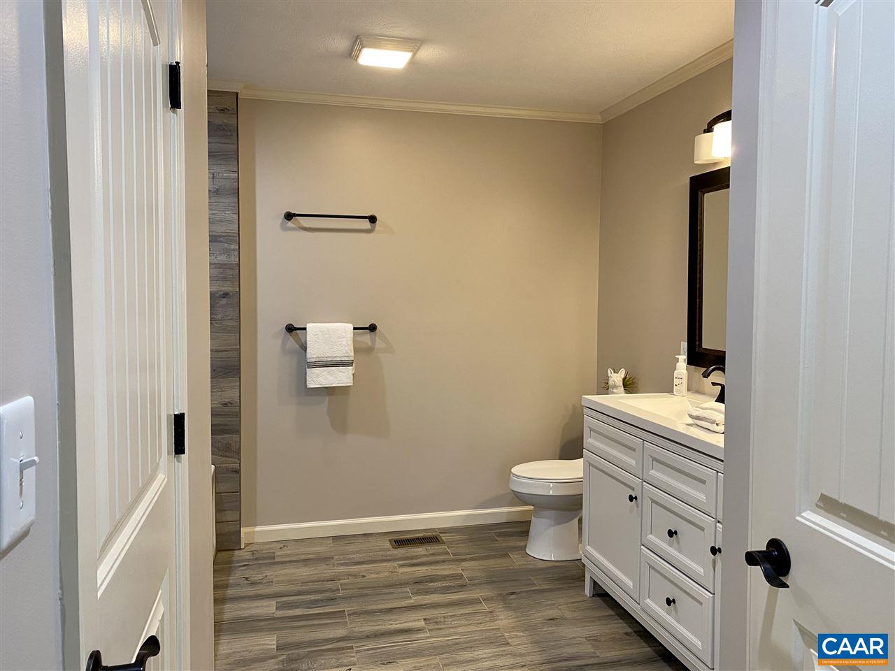907 New Hope Road Staunton, VA 24401 - Photo 34 of 50 a bathroom with a toilet sink and mirror