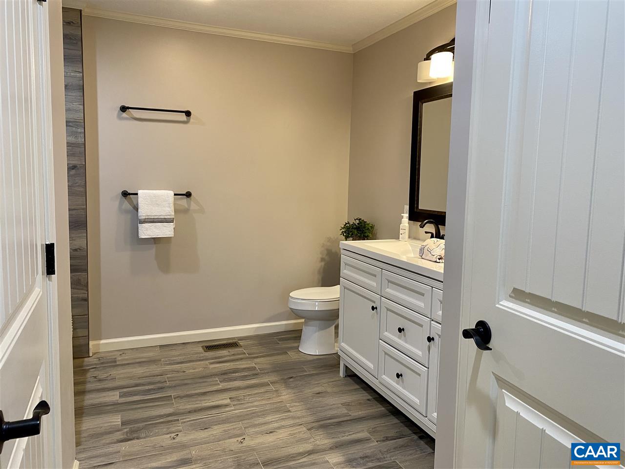 907 New Hope Road Staunton, VA 24401 - Photo 39 of 50 a bathroom with a toilet a sink and mirror