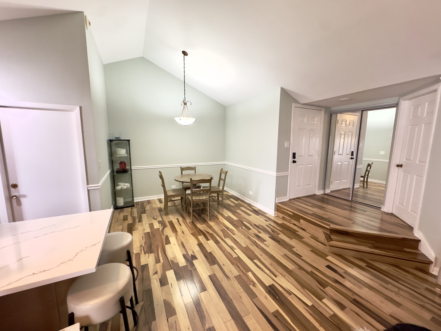 7210 Adams Street, Unit D Willowbrook, IL 60527 - Photo 4 of 19 a spacious bedroom with a bed and wooden floor