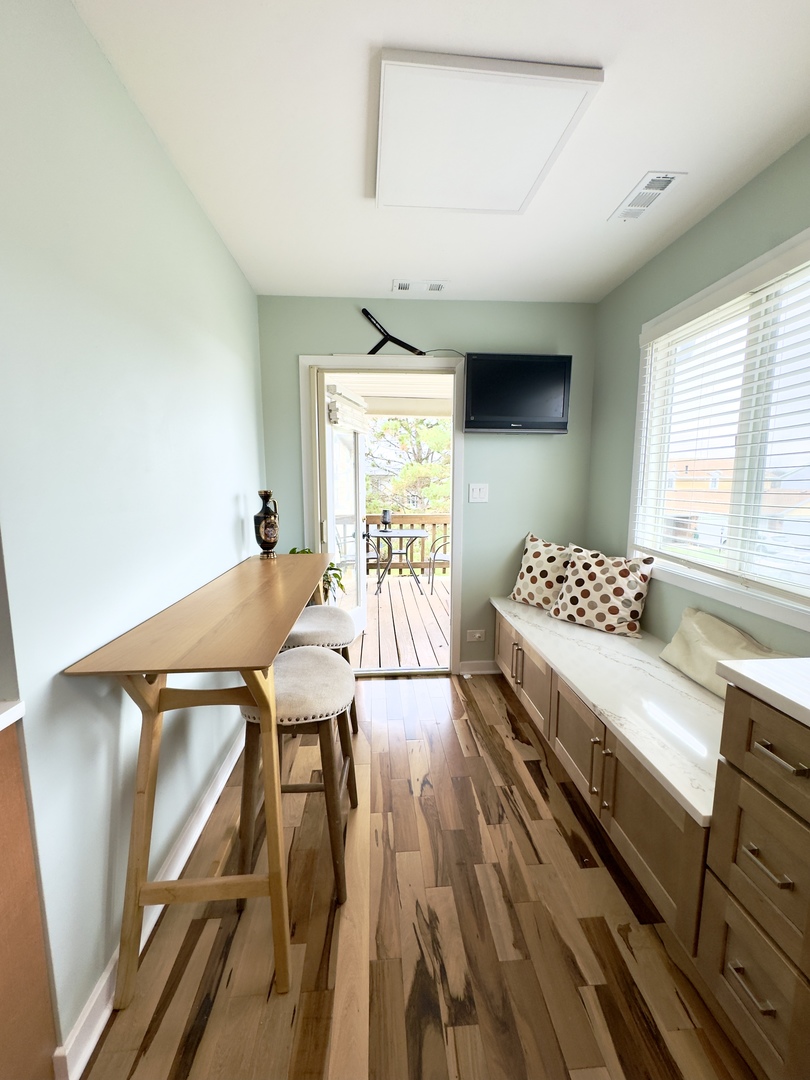 7210 Adams Street, Unit D Willowbrook, IL 60527 - Photo 9 of 19 a bedroom with a bed and a table