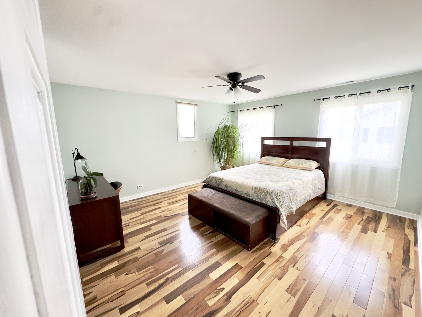 7210 Adams Street, Unit D Willowbrook, IL 60527 - Photo 10 of 19 a bedroom with a bed and wooden floor