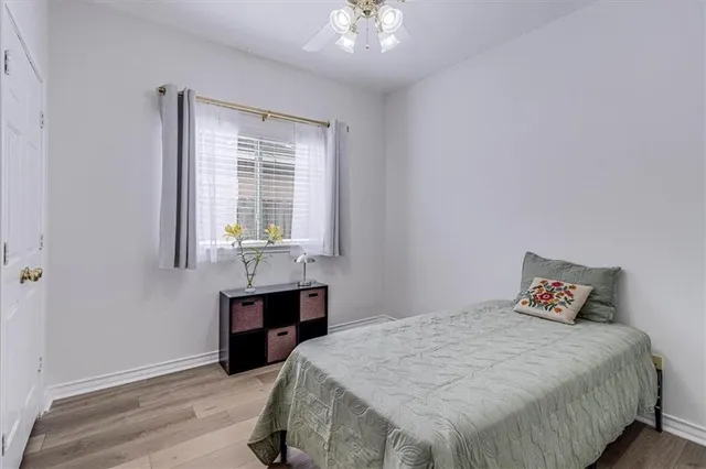 a bedroom with a bed and a table