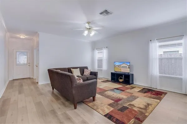 a living room with furniture and a fireplace