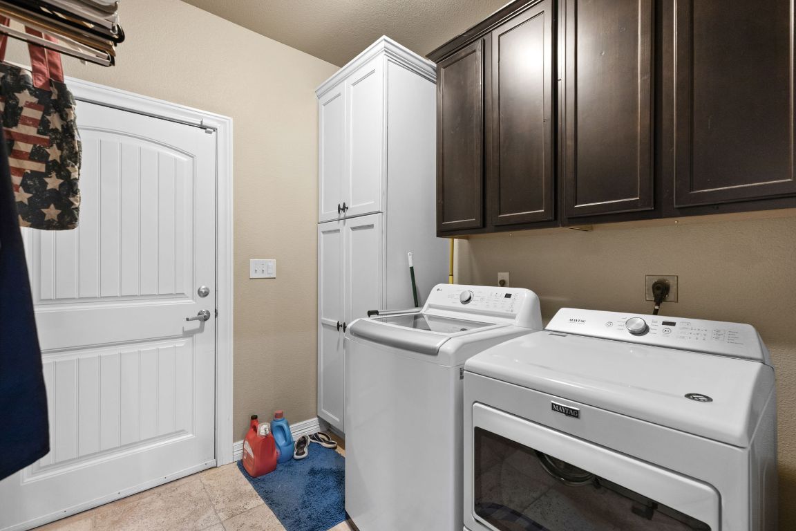1291 Mossy Hollow Road Spring Branch, TX 78070 - Photo 14 of 23 a utility room with dryer and washer