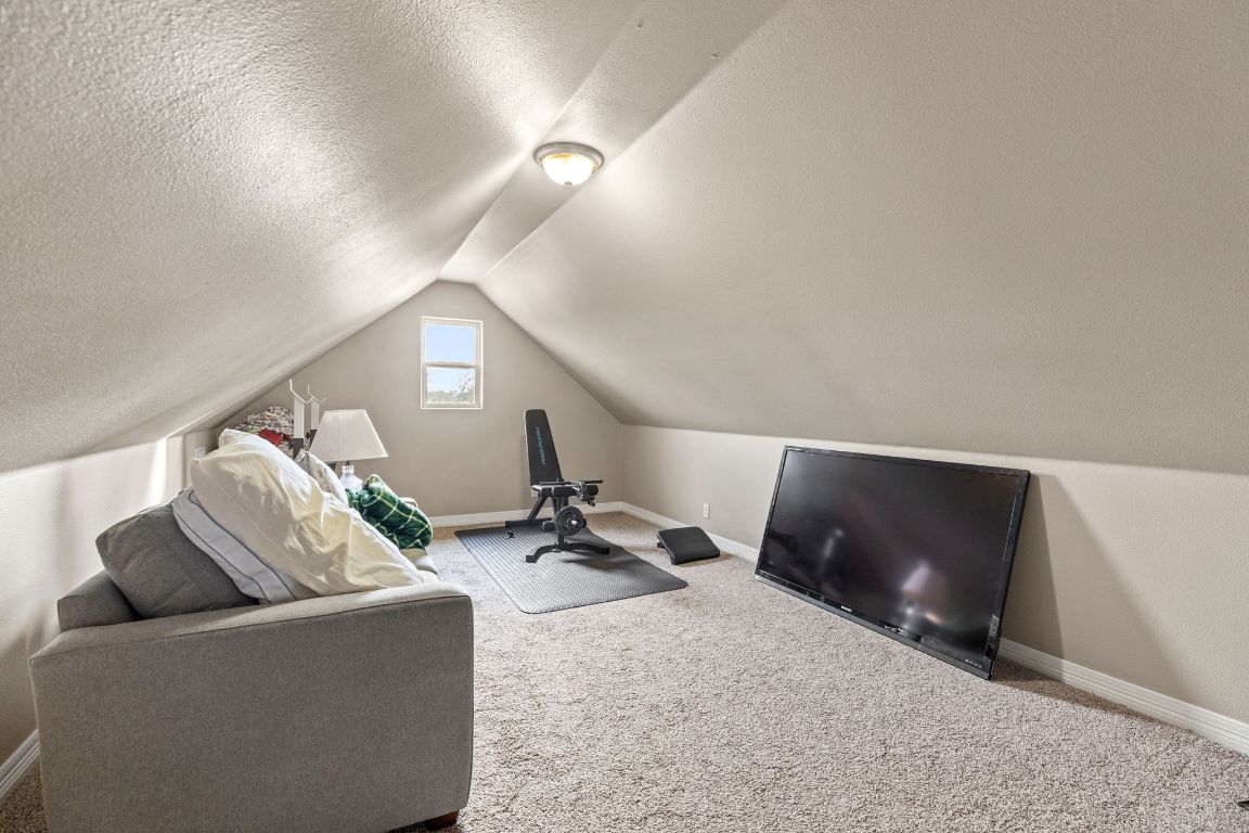 1291 Mossy Hollow Road Spring Branch, TX 78070 - Photo 15 of 23 a living room with furniture and a lamp