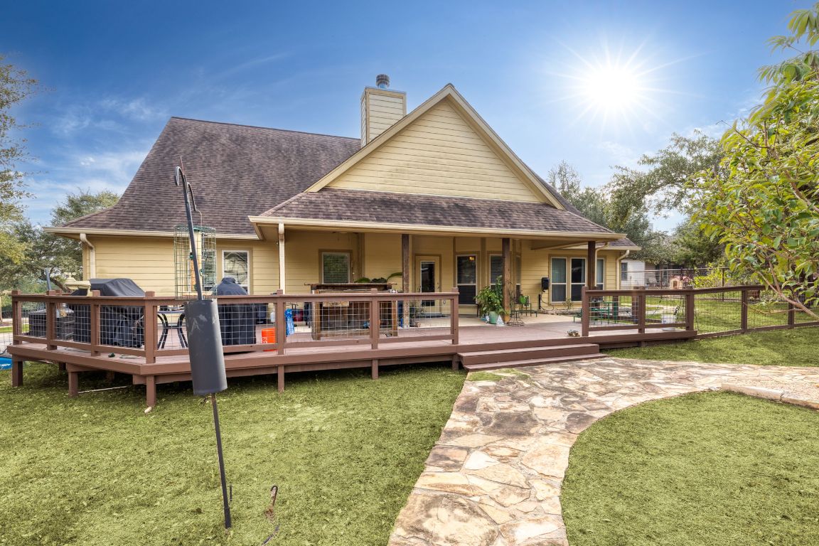 1291 Mossy Hollow Road Spring Branch, TX 78070 - Photo 21 of 23 a view of a house with swimming pool and sitting area