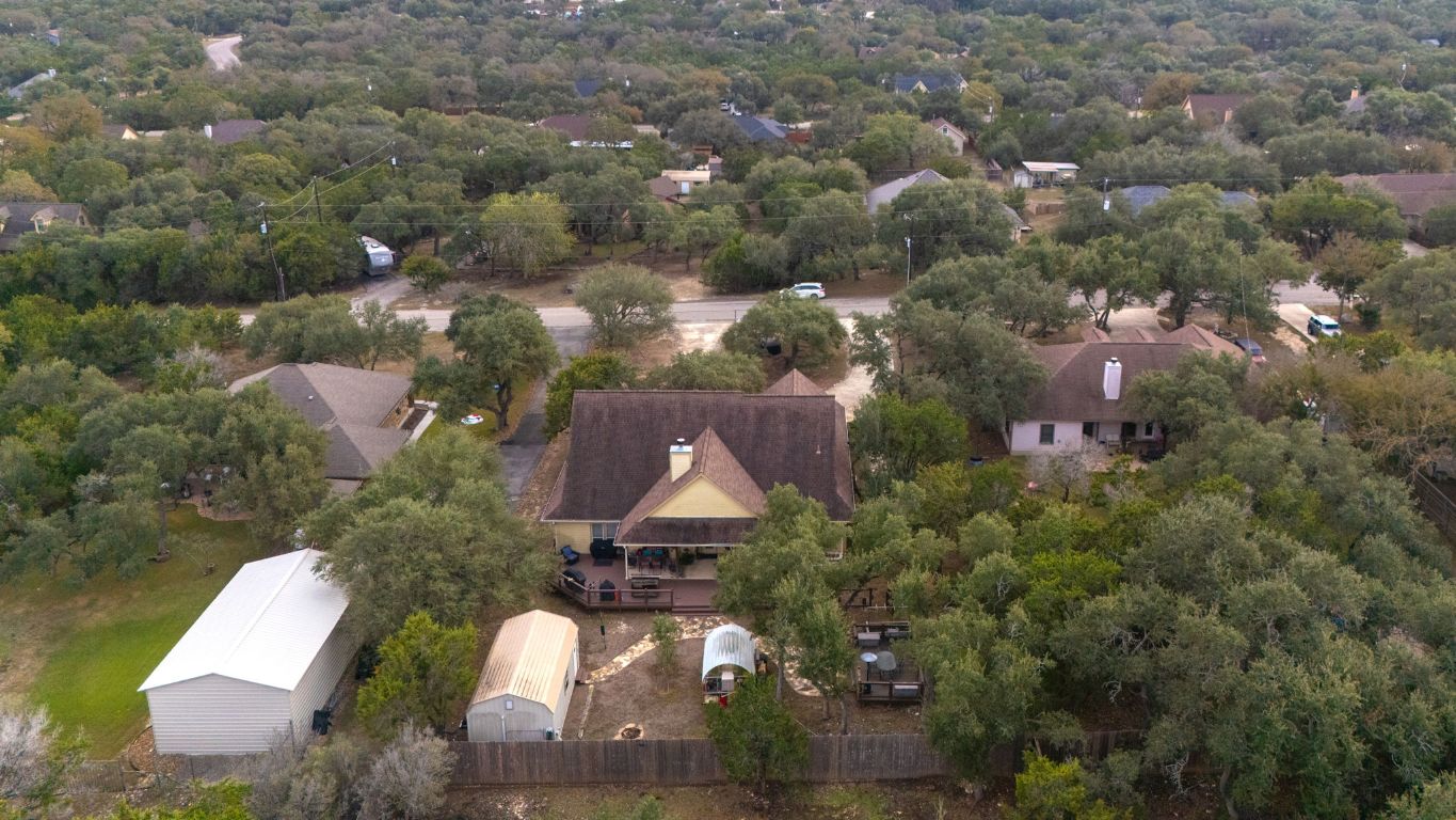 1291 Mossy Hollow Road Spring Branch, TX 78070 - Photo 23 of 23 an aerial view of residential houses with outdoor space and parking