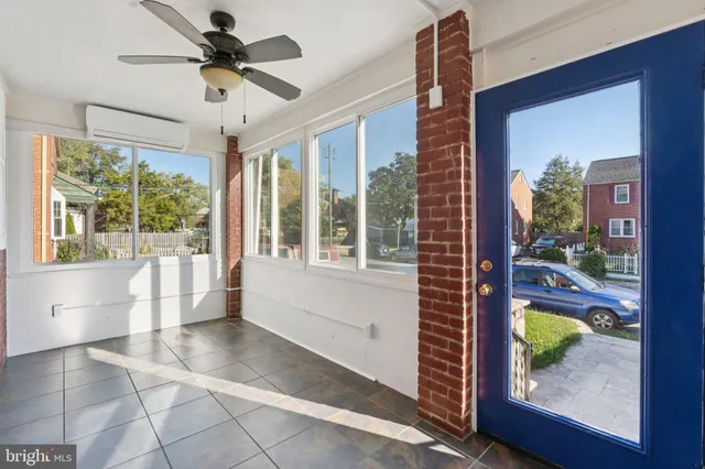 a view of hallway with furniture and a window