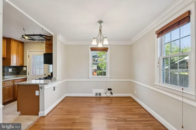 a kitchen with a sink and a large window