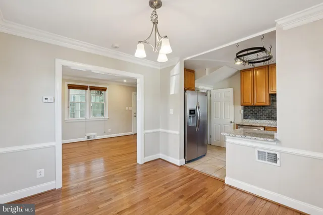 a view of a kitchen cabinets and wooden floor