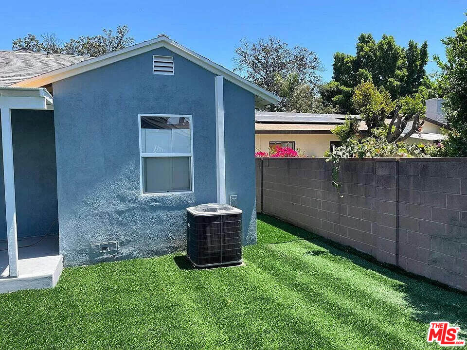 7669 Willis Avenue Van Nuys, CA 91405 - Photo 10 of 10 a front view of a house with a garden