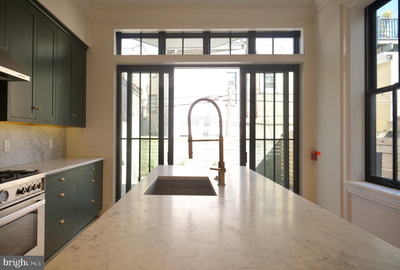1227 North 6th Street Philadelphia, PA 19122 - Photo 21 of 32 a view of an entryway with wooden floor