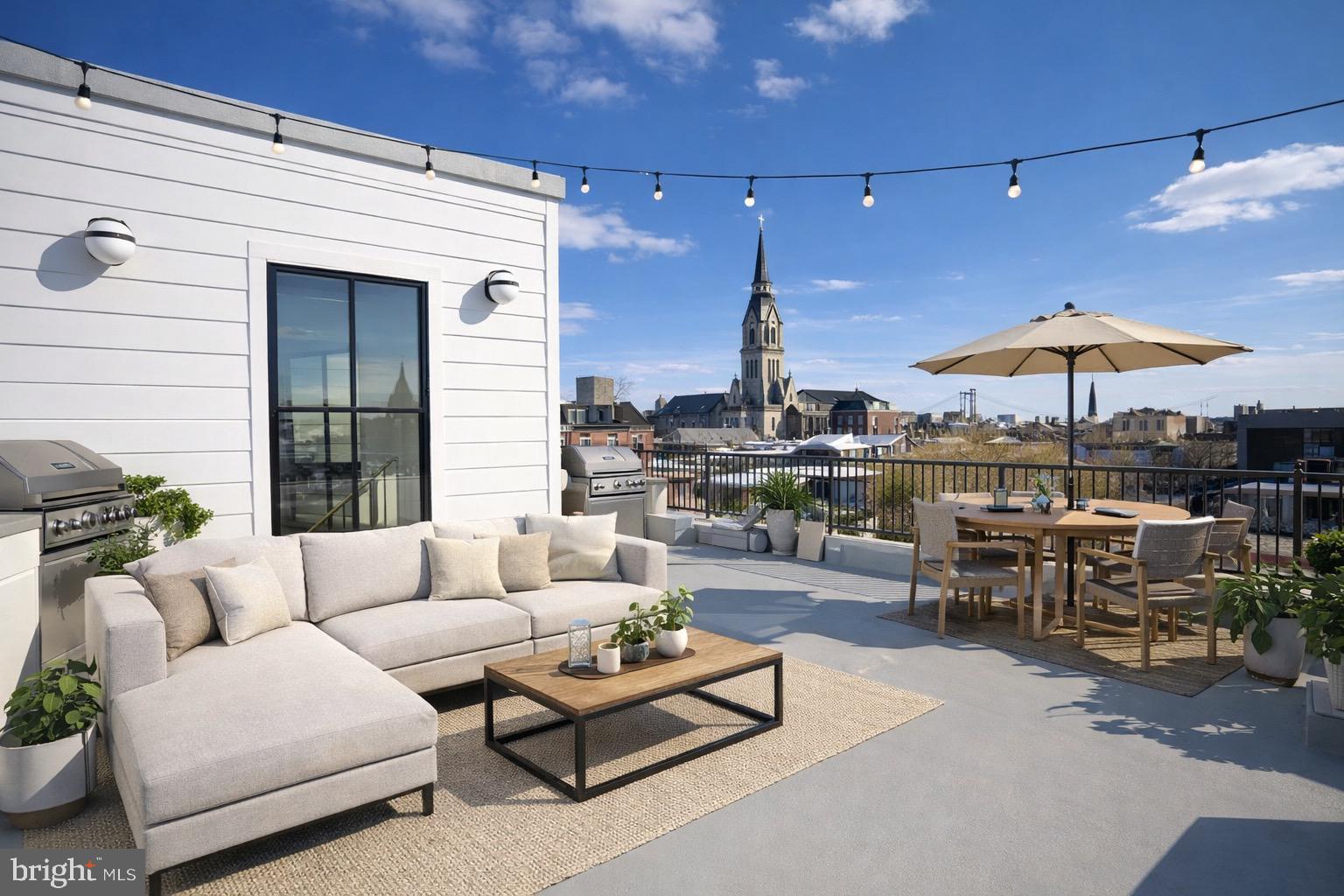 1227 North 6th Street Philadelphia, PA 19122 - Photo 25 of 32 a living room with patio furniture and a umbrella