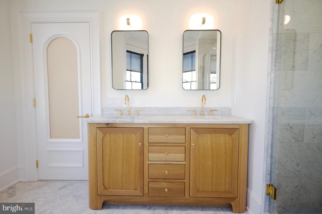 1227 North 6th Street Philadelphia, PA 19122 - Photo 8 of 32 a bathroom with a granite countertop sink and a mirror