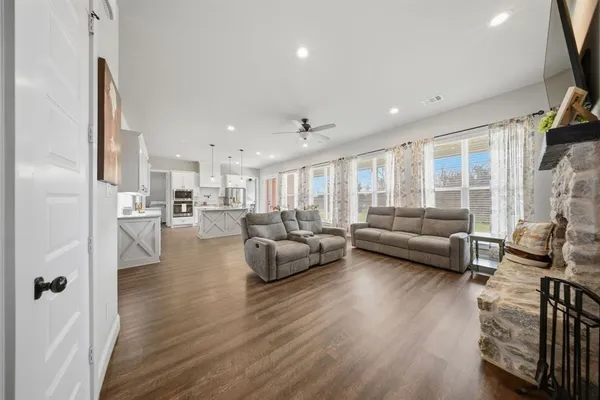 a living room with furniture fireplace and a flat screen tv