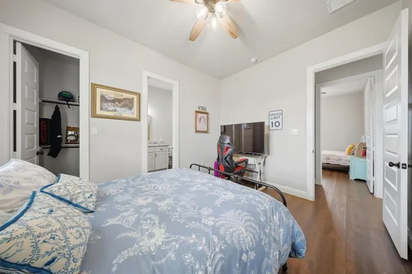 a bed room with a bed and a television