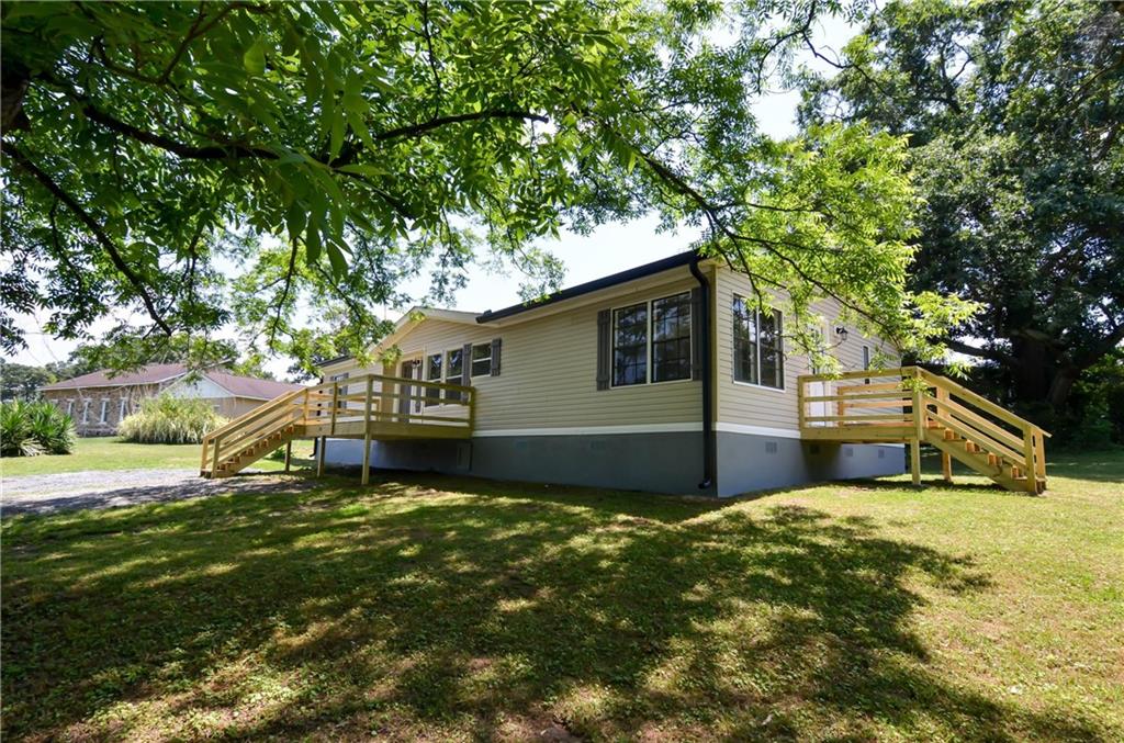 2260 Pine Chapel Road Northeast Resaca, GA 30735 - Photo 1 of 1 a view of a house with a backyard