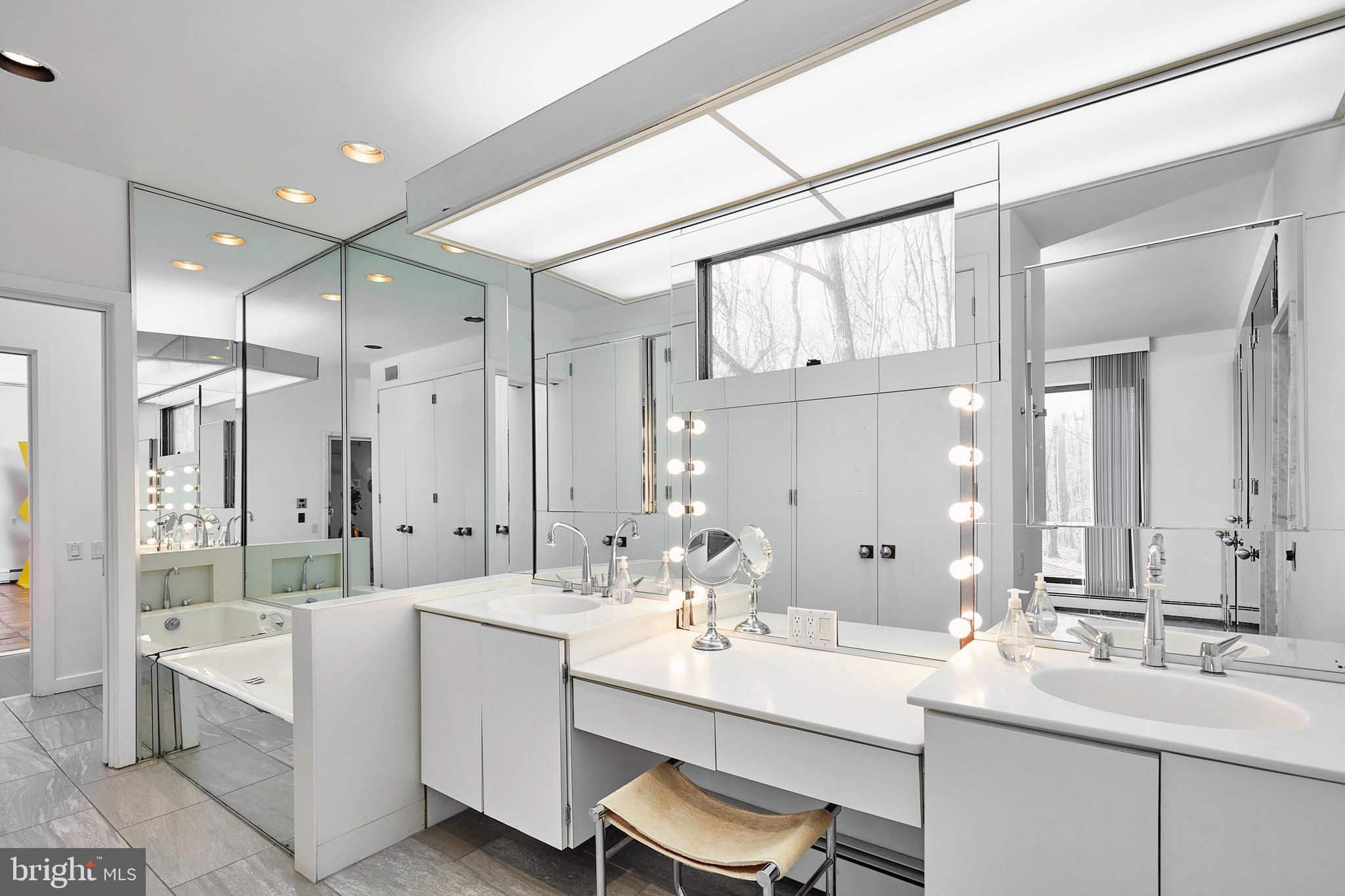 1371 Old Ford Road Huntingdon Valley, PA 19006 - Photo 25 of 37 a bathroom with a double vanity sink mirror double and shower