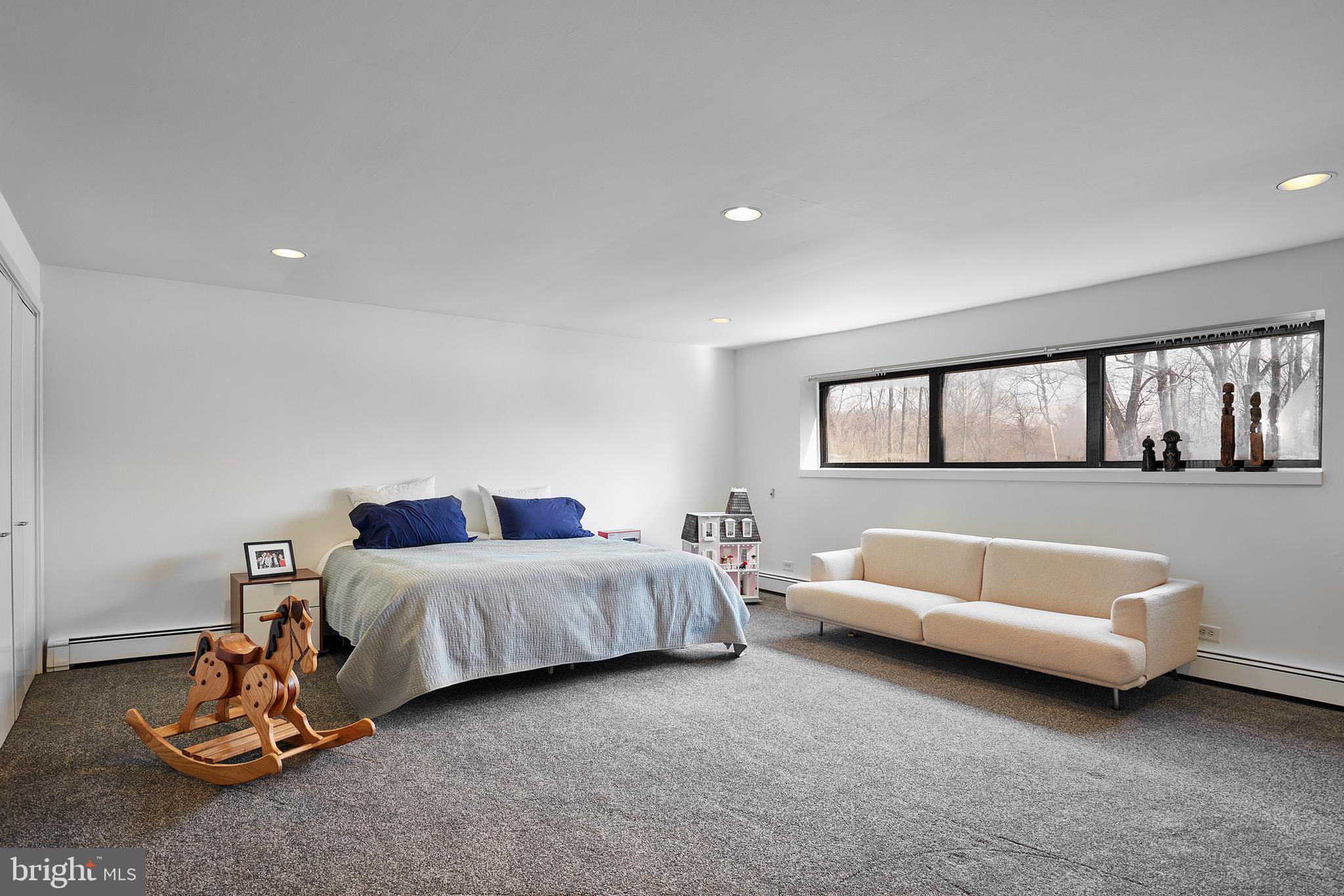 1371 Old Ford Road Huntingdon Valley, PA 19006 - Photo 29 of 37 a spacious bedroom with a bed and a couch