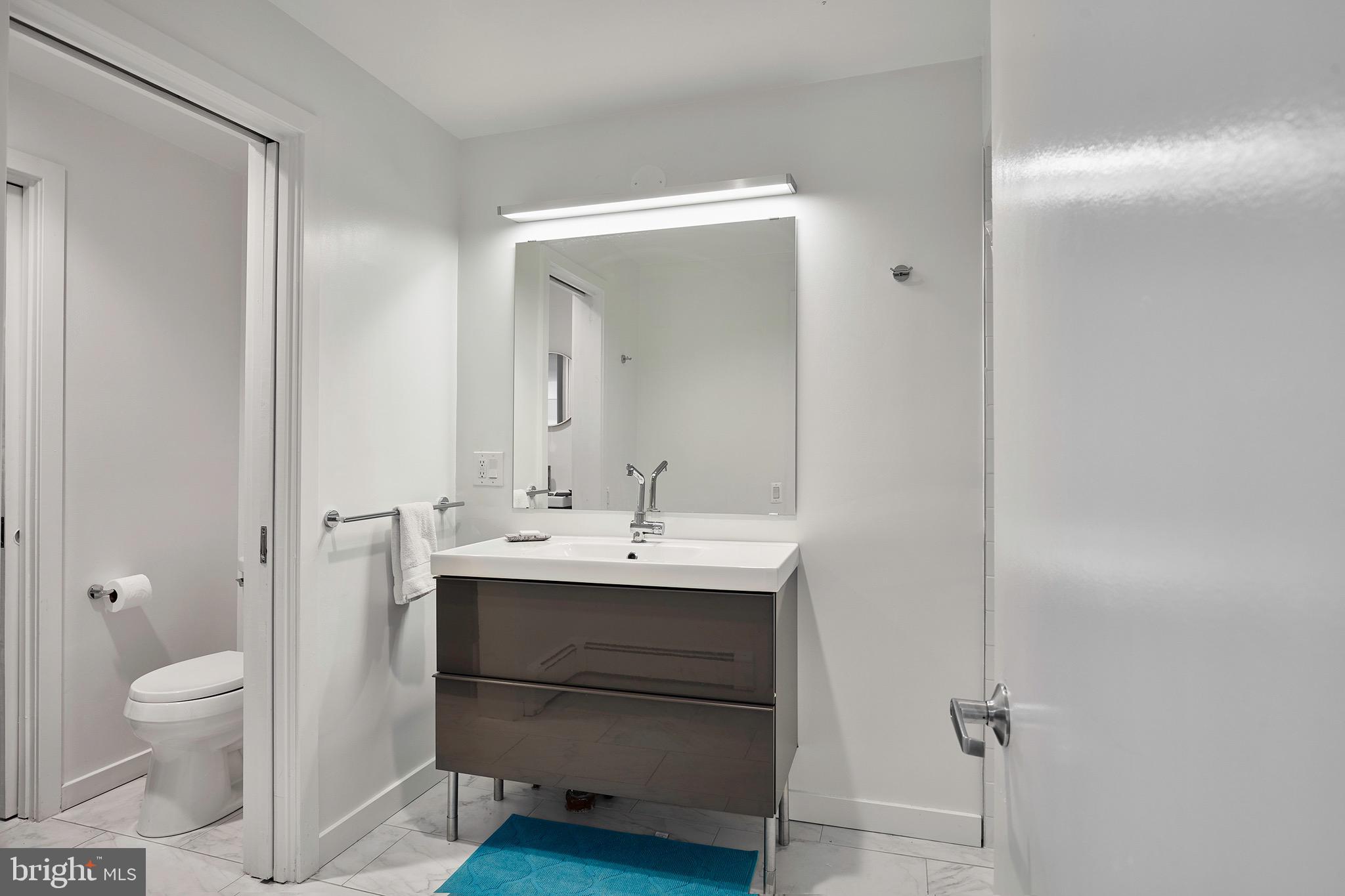 1371 Old Ford Road Huntingdon Valley, PA 19006 - Photo 30 of 37 a bathroom with a toilet a sink and mirror