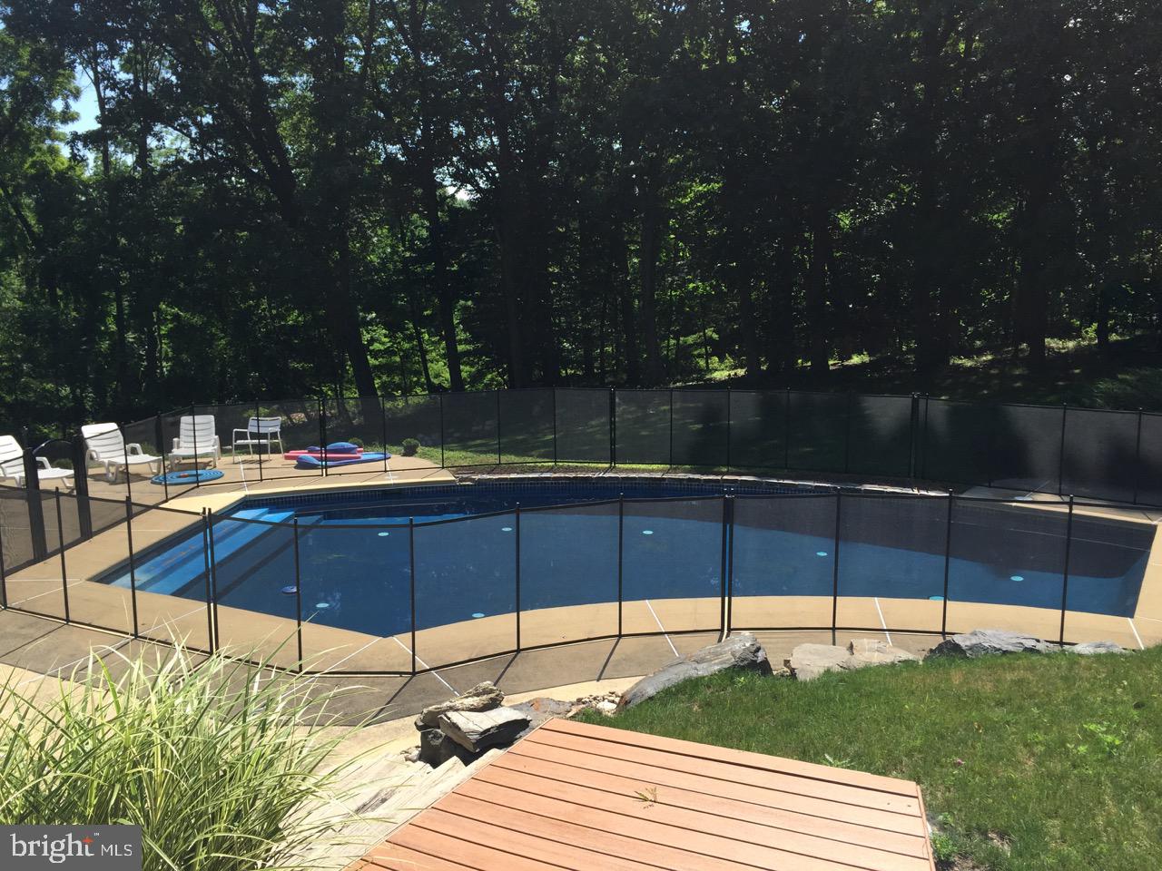 1371 Old Ford Road Huntingdon Valley, PA 19006 - Photo 37 of 37 a view of a swimming pool with a lounge chairs