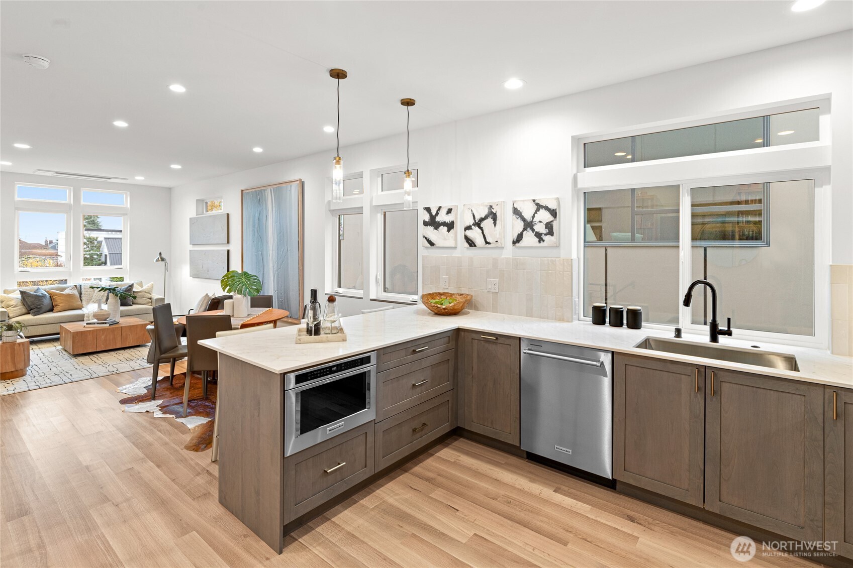 311 17th Avenue East Seattle, WA 98112 - Photo 12 of 39 a kitchen with a sink stove and cabinets
