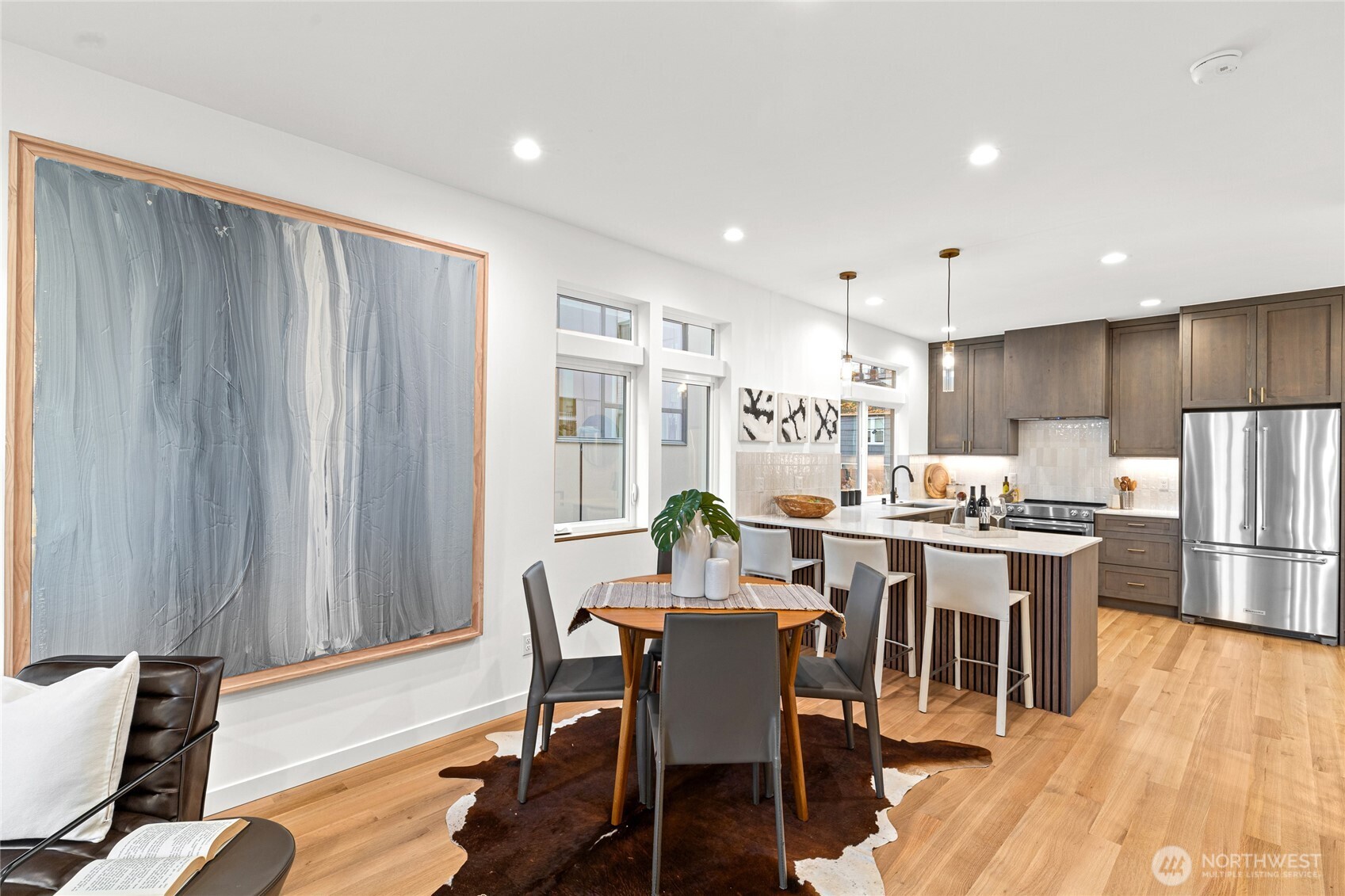 311 17th Avenue East Seattle, WA 98112 - Photo 15 of 39 a view of a dining room with furniture window and wooden floor