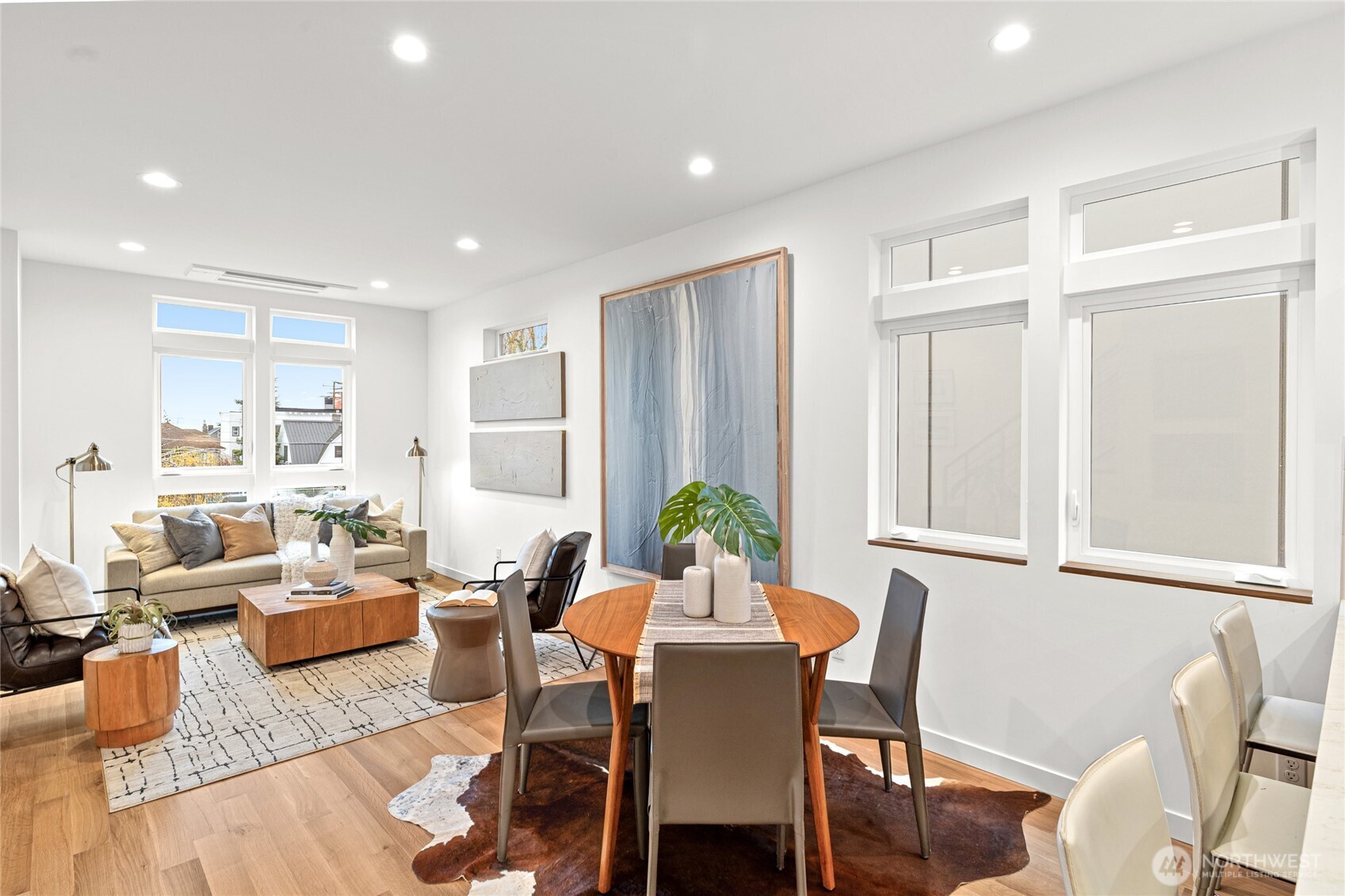 311 17th Avenue East Seattle, WA 98112 - Photo 17 of 39 a living room with furniture wooden floor and a potted plant