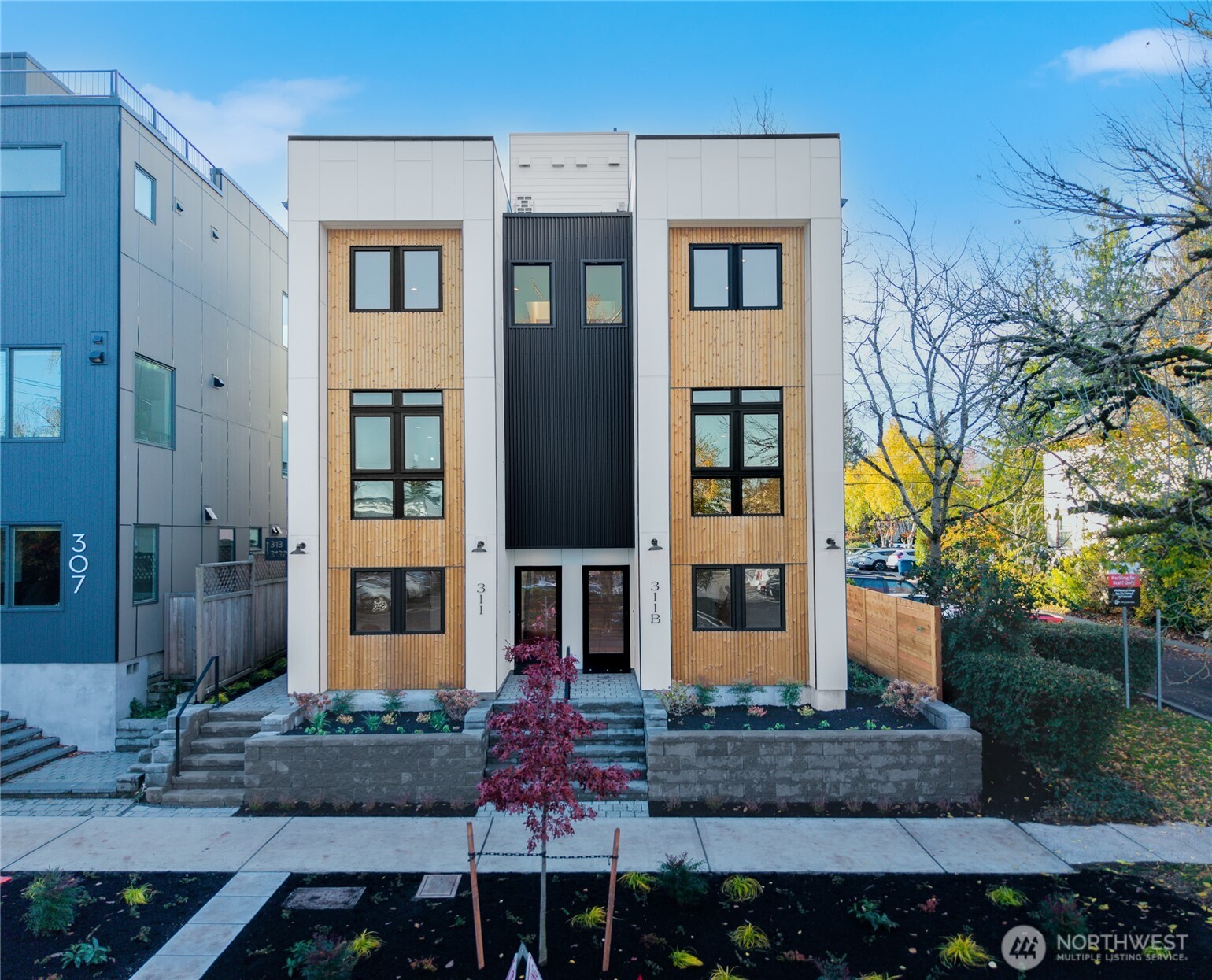 311 17th Avenue East Seattle, WA 98112 - Photo 2 of 39 a front view of a house with a yard