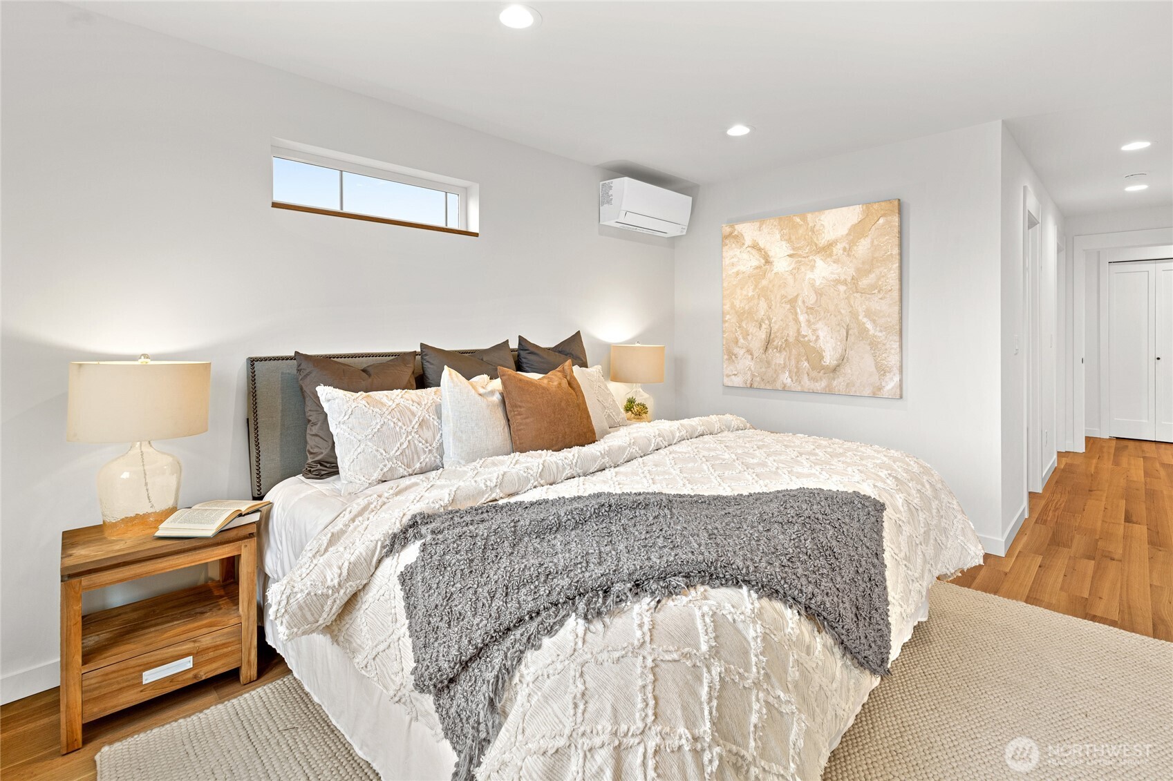311 17th Avenue East Seattle, WA 98112 - Photo 23 of 39 a spacious bedroom with a bed and a window