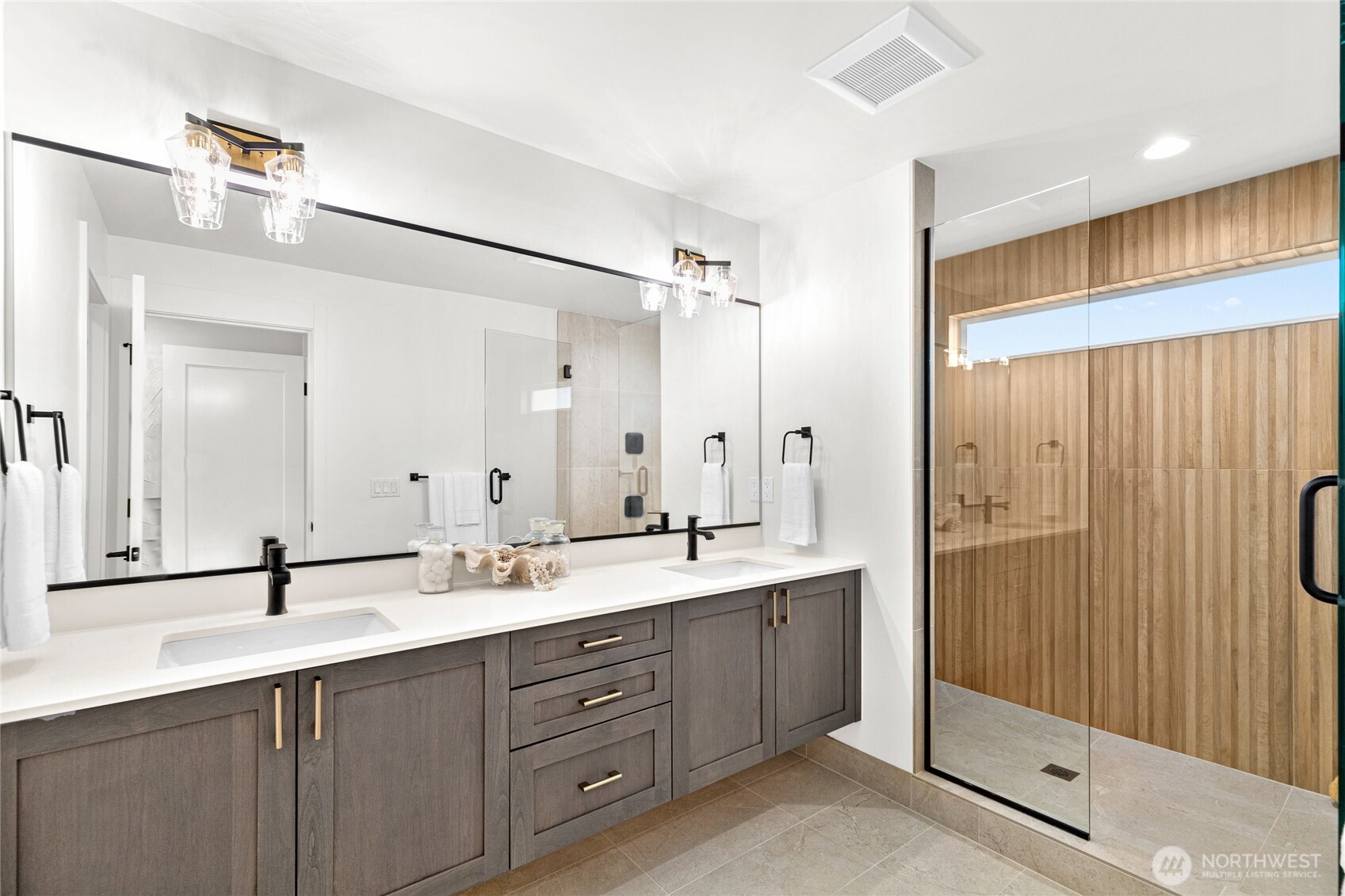 311 17th Avenue East Seattle, WA 98112 - Photo 26 of 39 a bathroom with a double vanity sink mirror and double