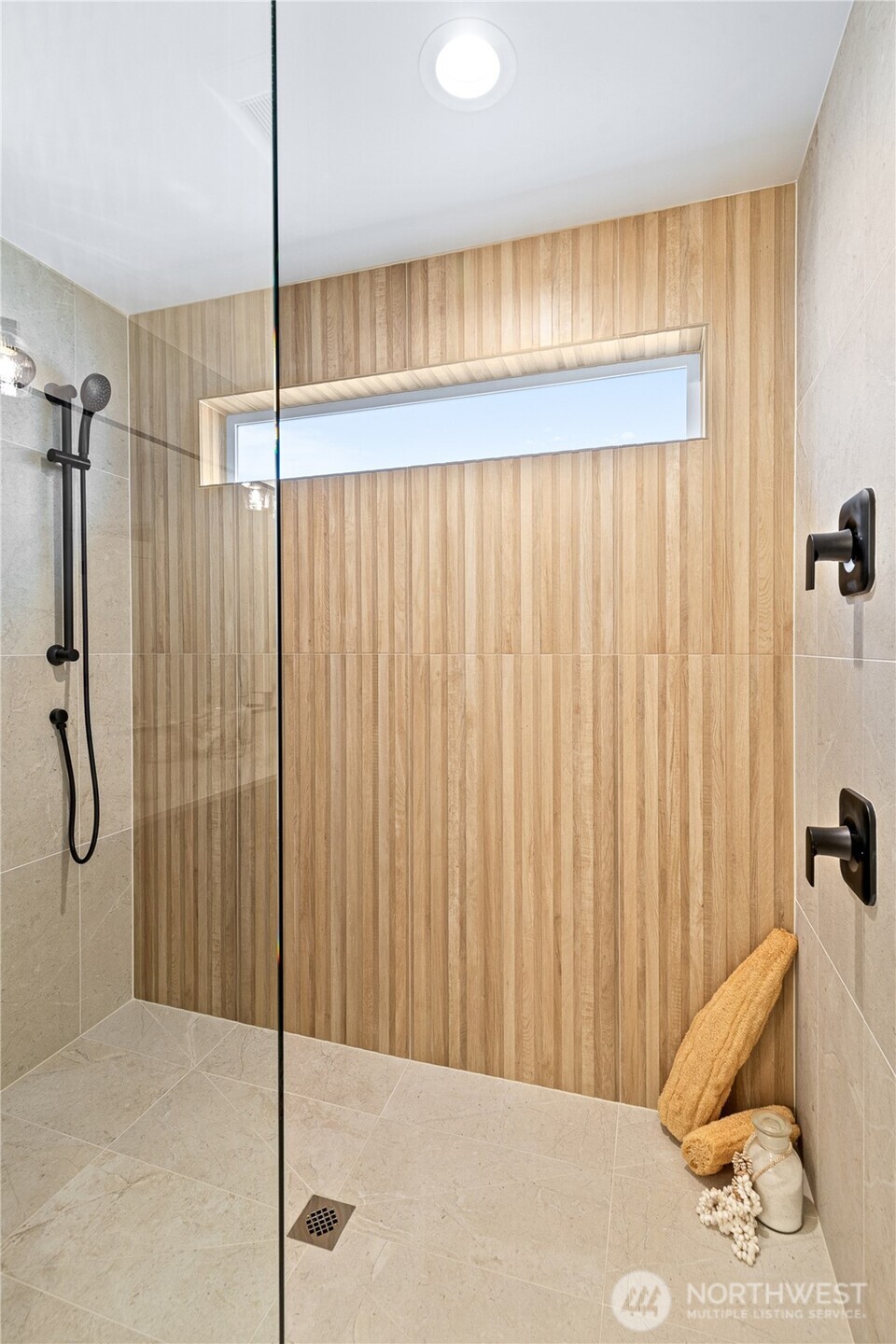 311 17th Avenue East Seattle, WA 98112 - Photo 27 of 39 a bathroom with a shower and a tub