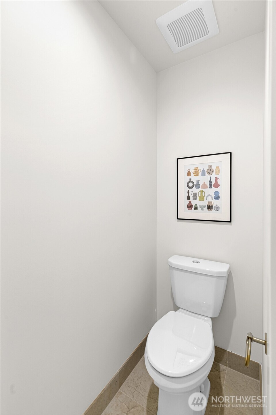 311 17th Avenue East Seattle, WA 98112 - Photo 28 of 39 a white toilet sitting next to a white wall