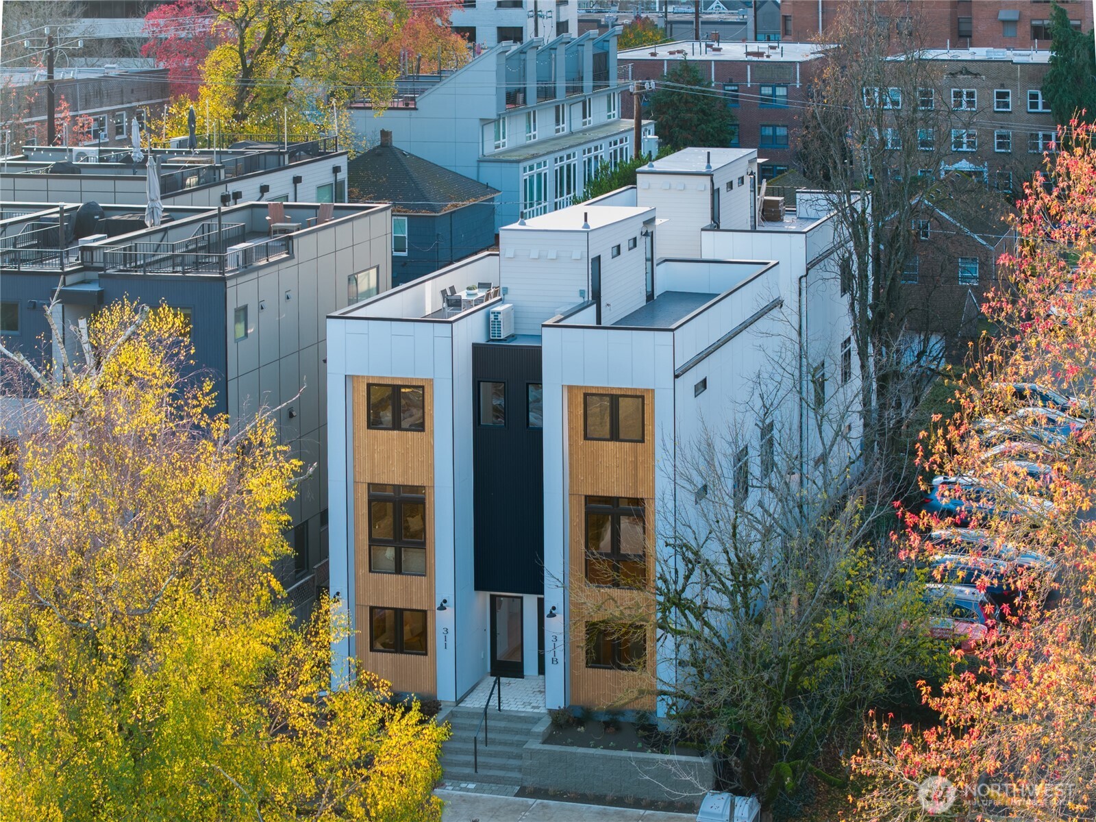 311 17th Avenue East Seattle, WA 98112 - Photo 34 of 39 a front view of a house with large trees and plants