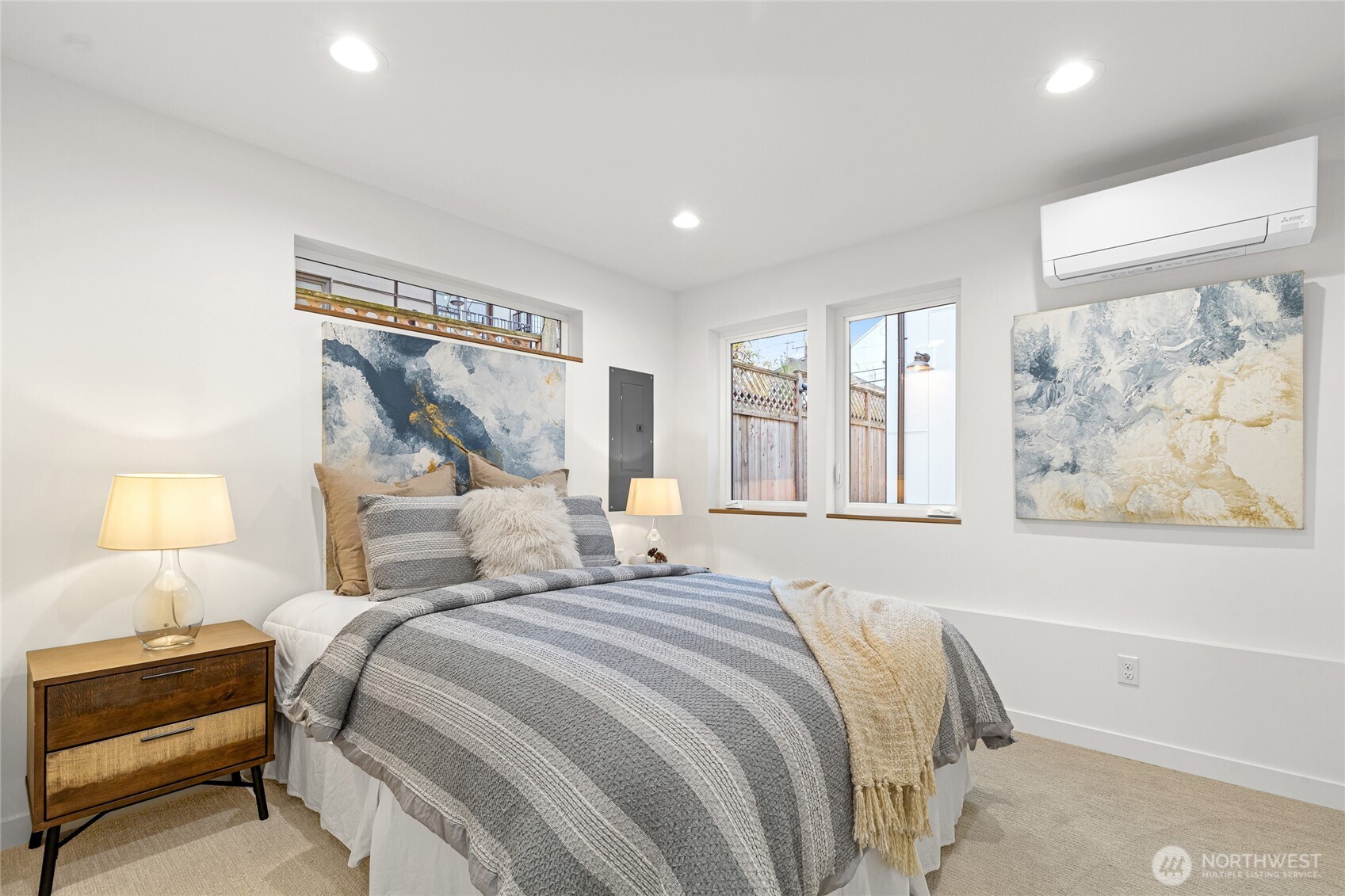 311 17th Avenue East Seattle, WA 98112 - Photo 8 of 39 a bedroom with a bed and a lamp