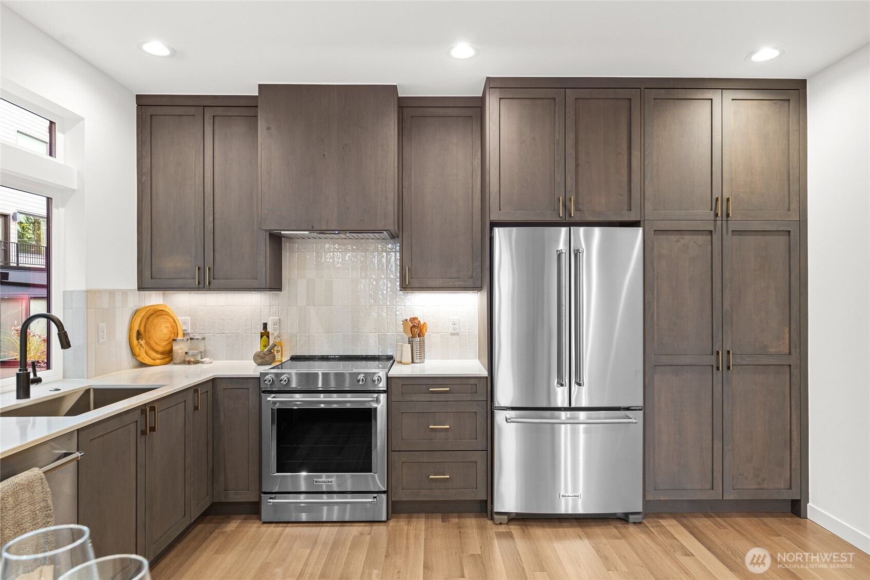 311 17th Avenue East Seattle, WA 98112 - Photo 9 of 39 a kitchen with a refrigerator and a sink