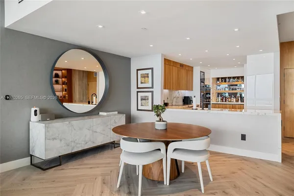 a living room with furniture and a mirror