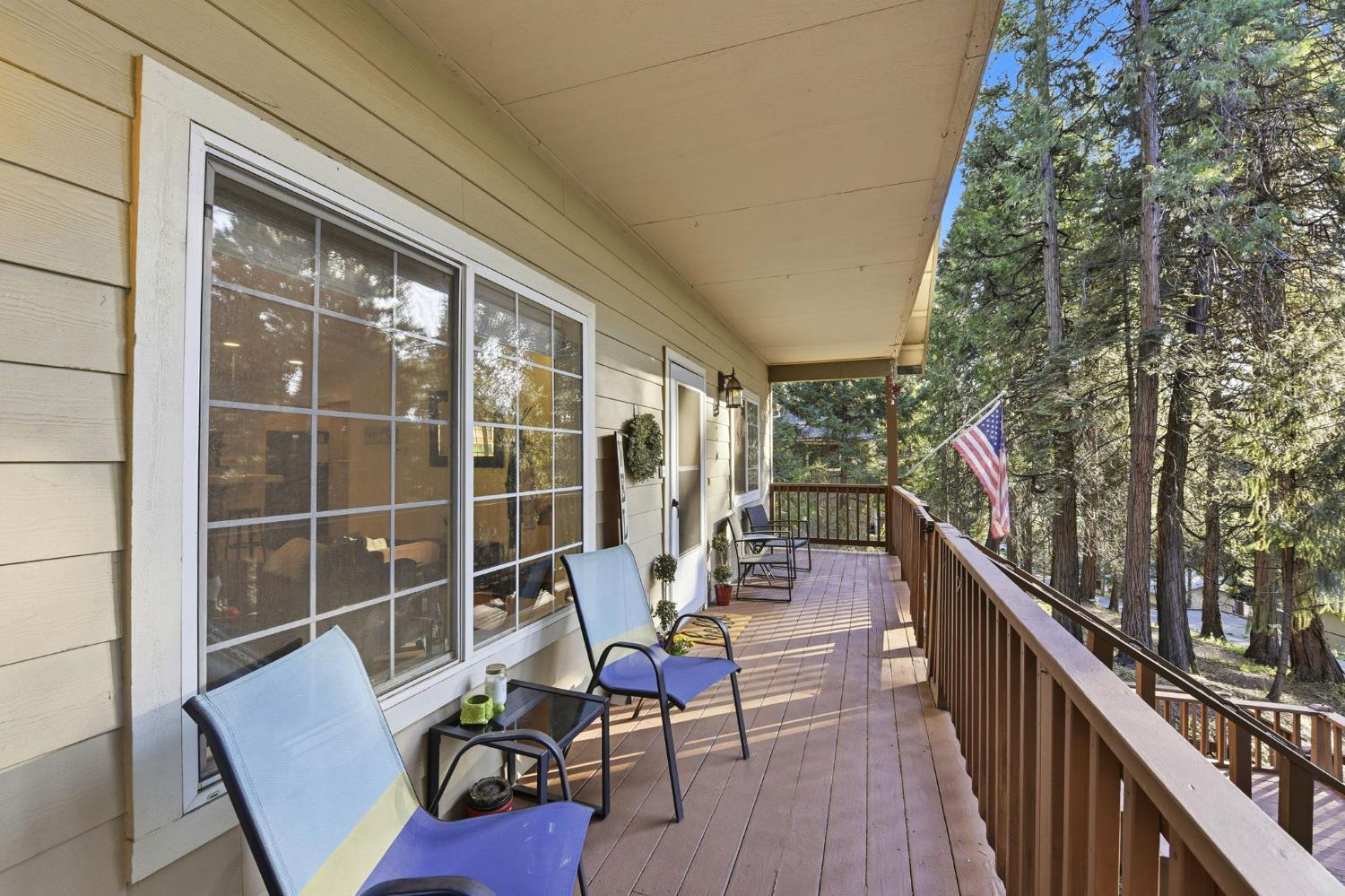 2845 Viona Road Pollock Pines, CA 95726 - Photo 3 of 32 Relax on this spacious covered front deck as you sip your morning coffee or relax at the end of a long day.