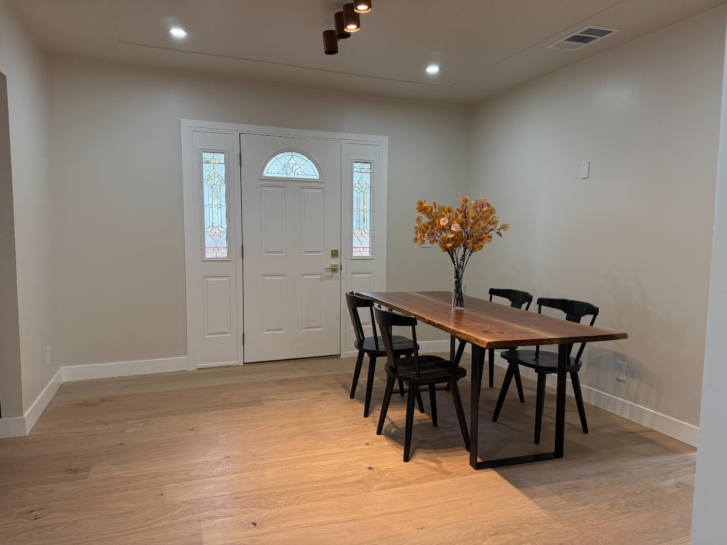 199 South 23rd Street San Jose, CA 95116 - Photo 11 of 33 a view of a dining room with furniture and wooden floor
