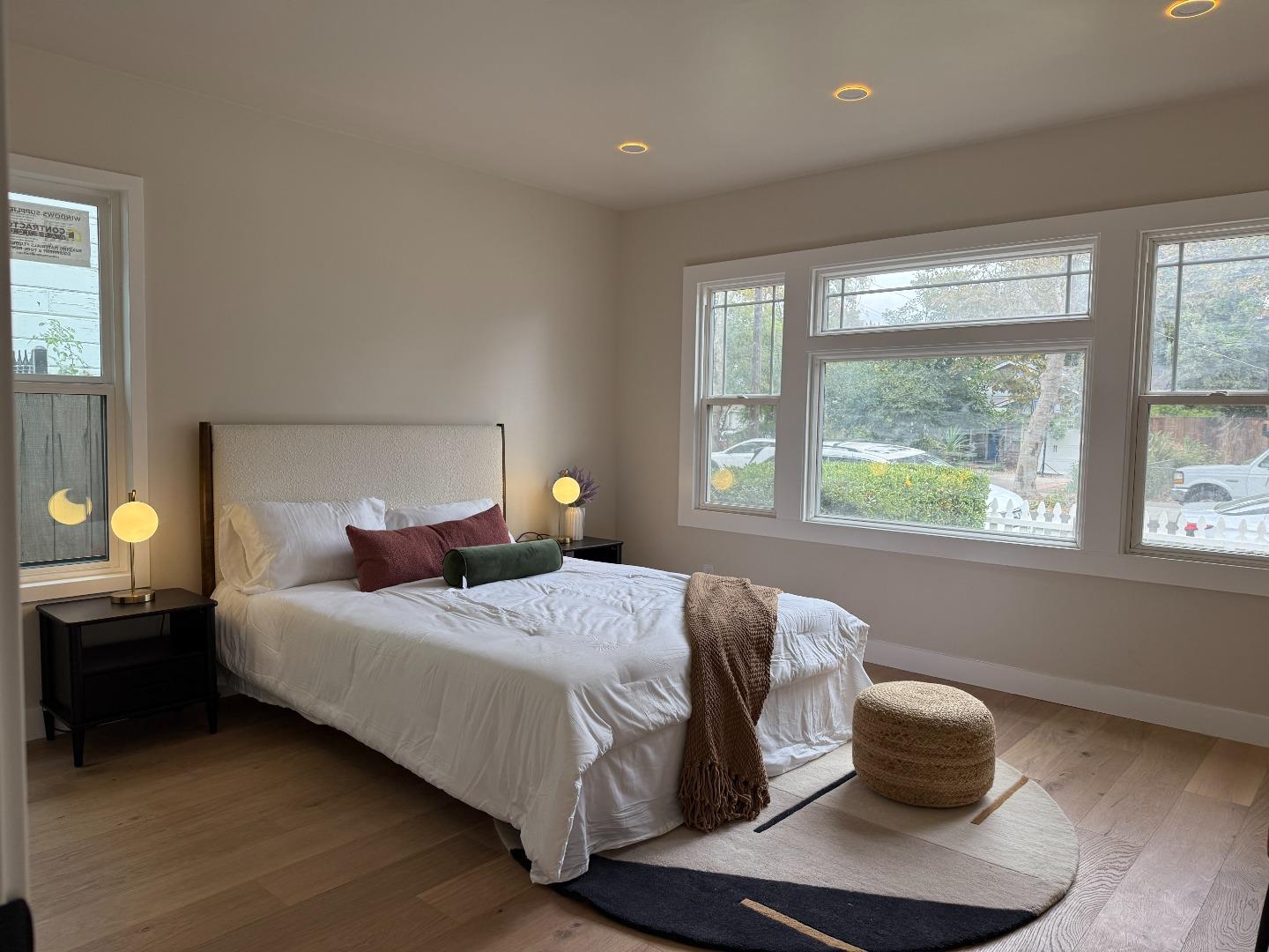 199 South 23rd Street San Jose, CA 95116 - Photo 17 of 33 a bedroom with a bed and a large window