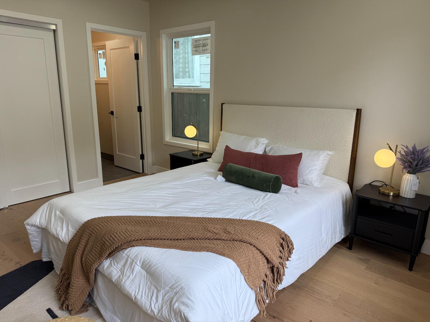 199 South 23rd Street San Jose, CA 95116 - Photo 18 of 33 a bedroom with a bed and window