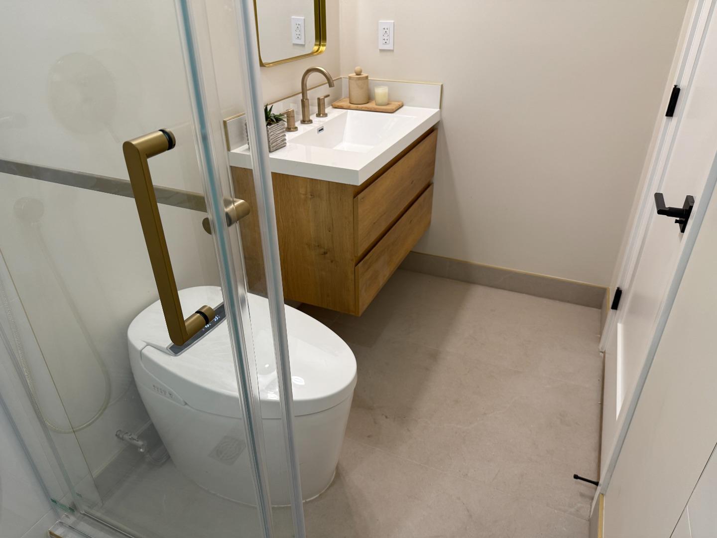 199 South 23rd Street San Jose, CA 95116 - Photo 19 of 33 a bathroom with a sink and a mirror