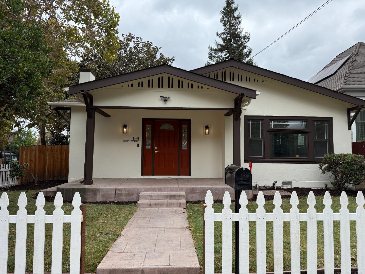 199 South 23rd Street San Jose, CA 95116 - Photo 2 of 33 a front view of white house with a garden