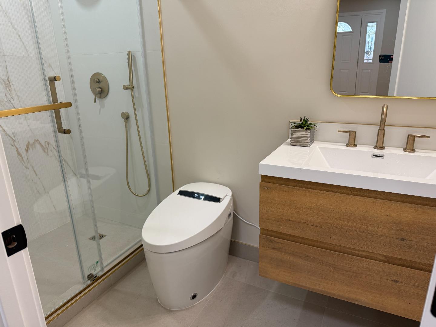 199 South 23rd Street San Jose, CA 95116 - Photo 26 of 33 a bathroom with a sink a toilet and shower