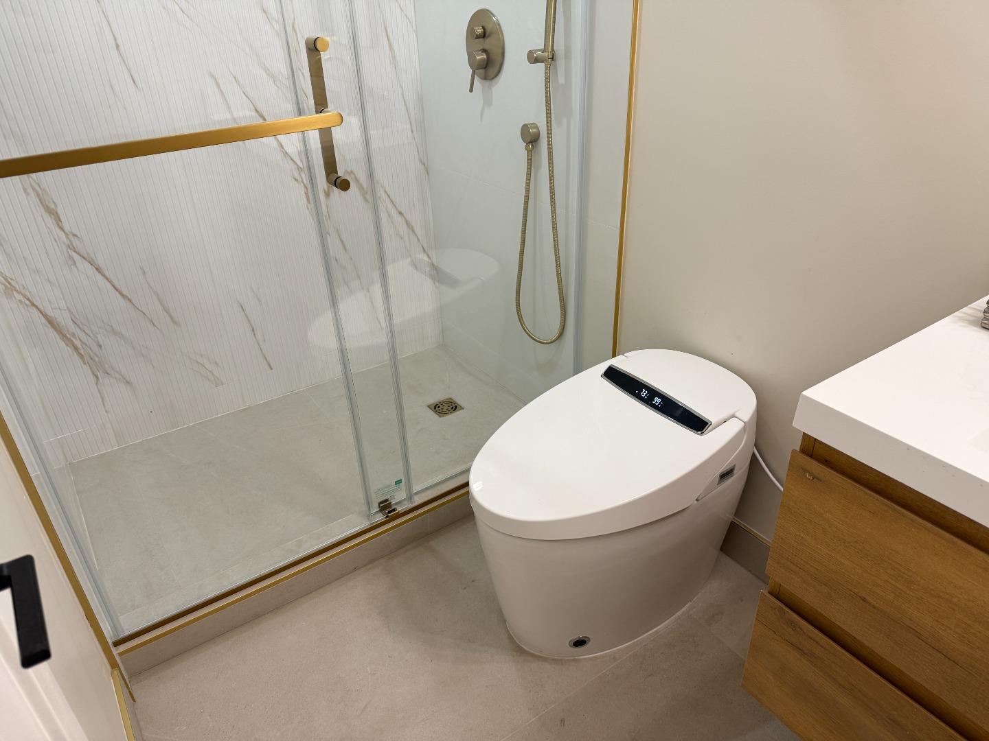 199 South 23rd Street San Jose, CA 95116 - Photo 28 of 33 a white toilet sitting next to a shower