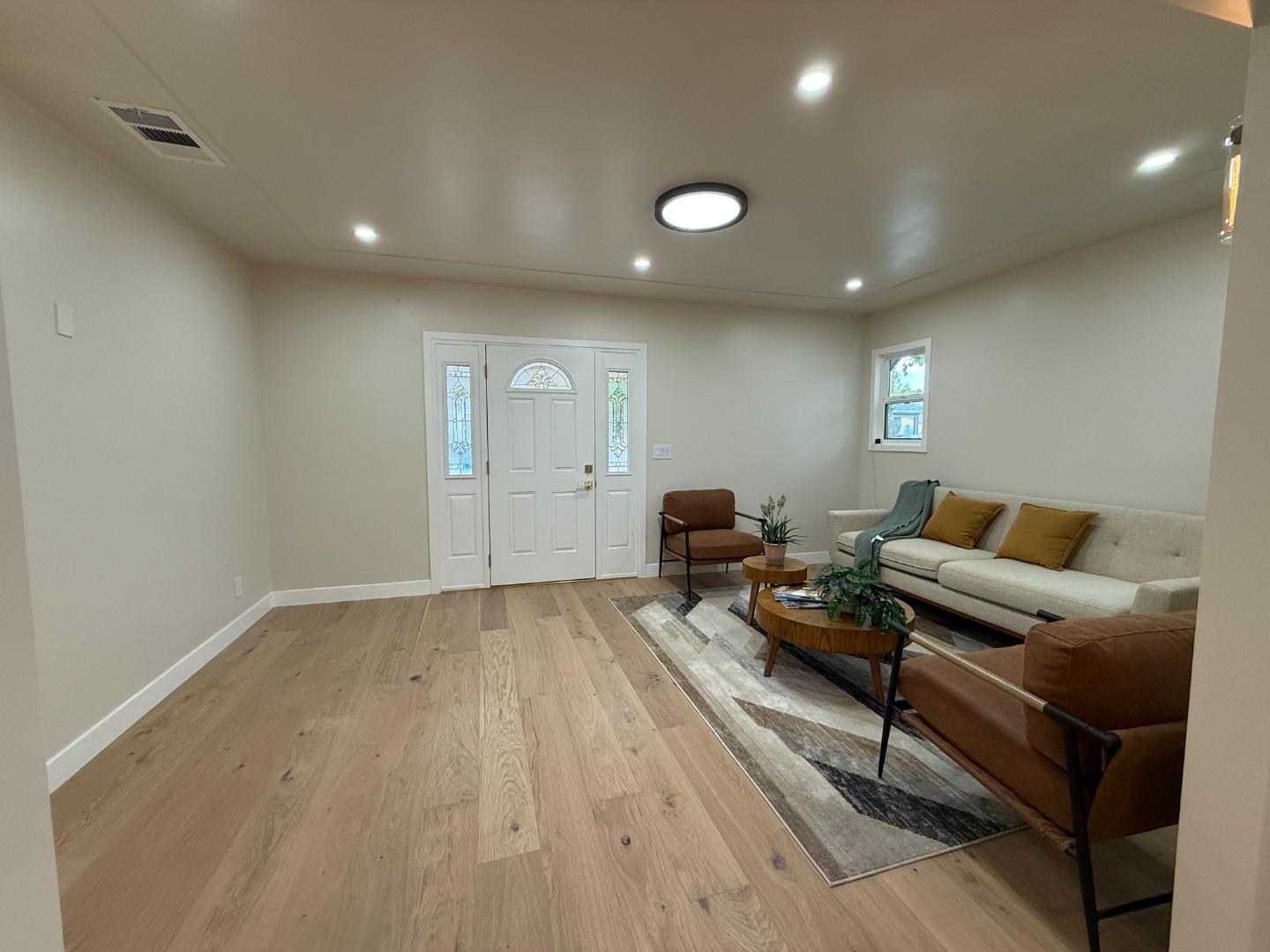 199 South 23rd Street San Jose, CA 95116 - Photo 6 of 33 a living room with furniture and a wooden floor
