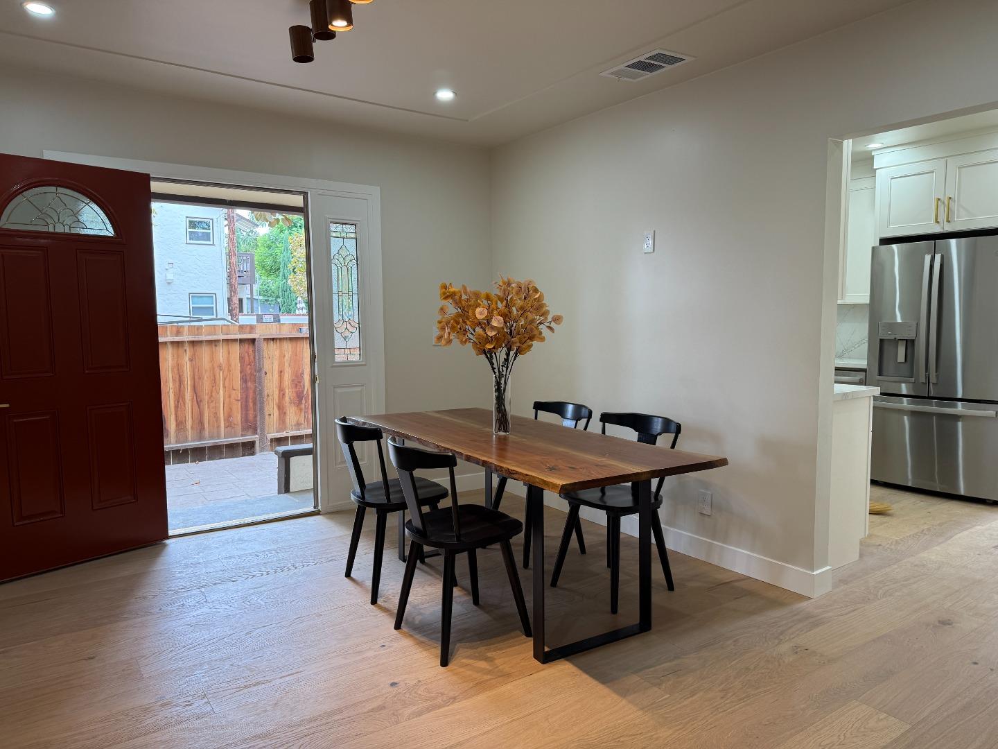 199 South 23rd Street San Jose, CA 95116 - Photo 10 of 33 a view of a dining room with furniture window and wooden floor