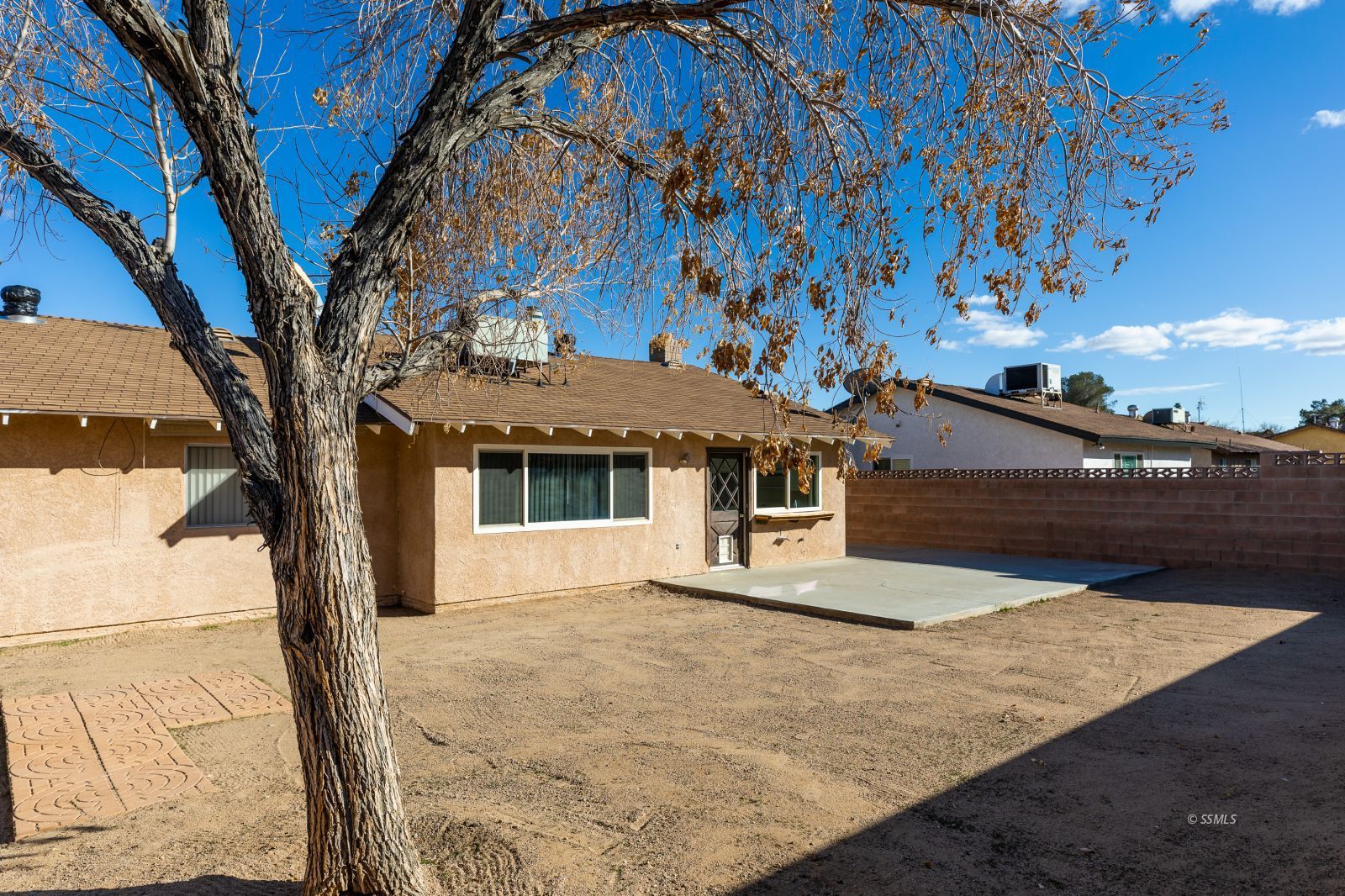 1225 North Erwin Street Ridgecrest, CA 93555 - Photo 25 of 27 a house with trees in front of it